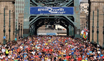 Runners under a bridge