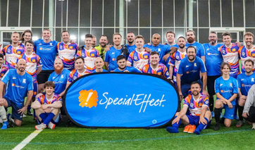 Group of footballers and a SpecialEffect banner